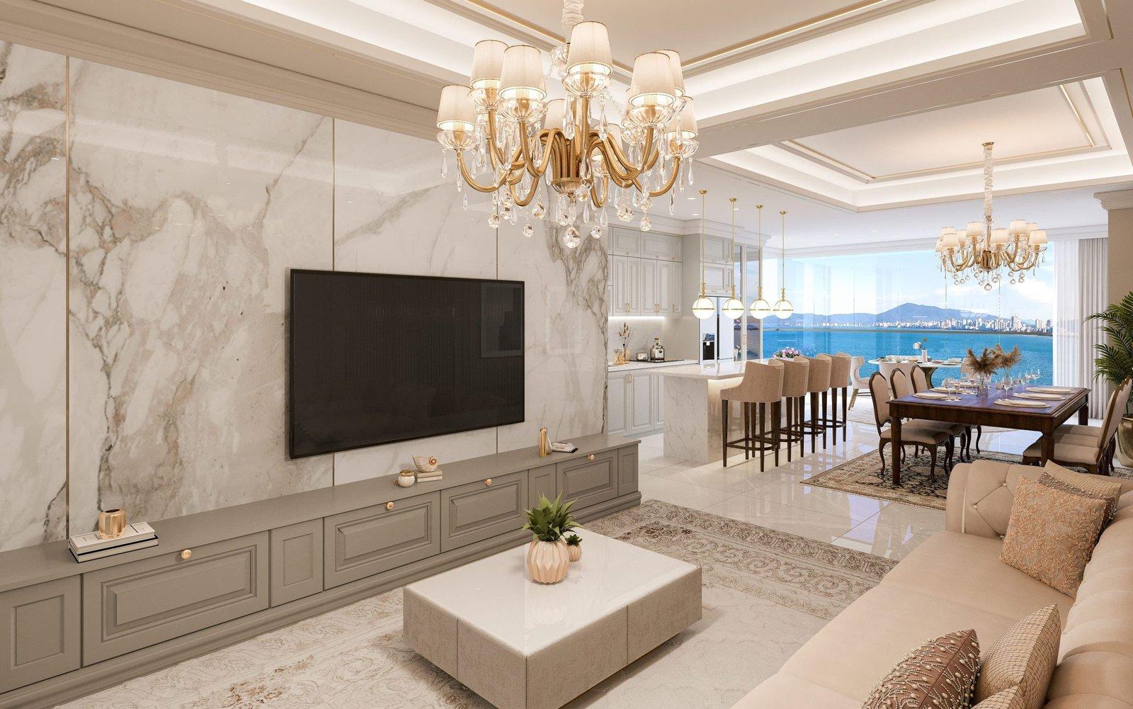Living integrado de um apartamento do George VI Residencial, com cozinha, jantar e vista para o mar